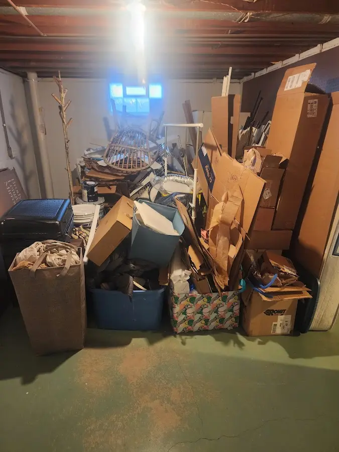 Roll-off dumpster container at job site for Yard Waste Dumpster Rental in Wilbraham